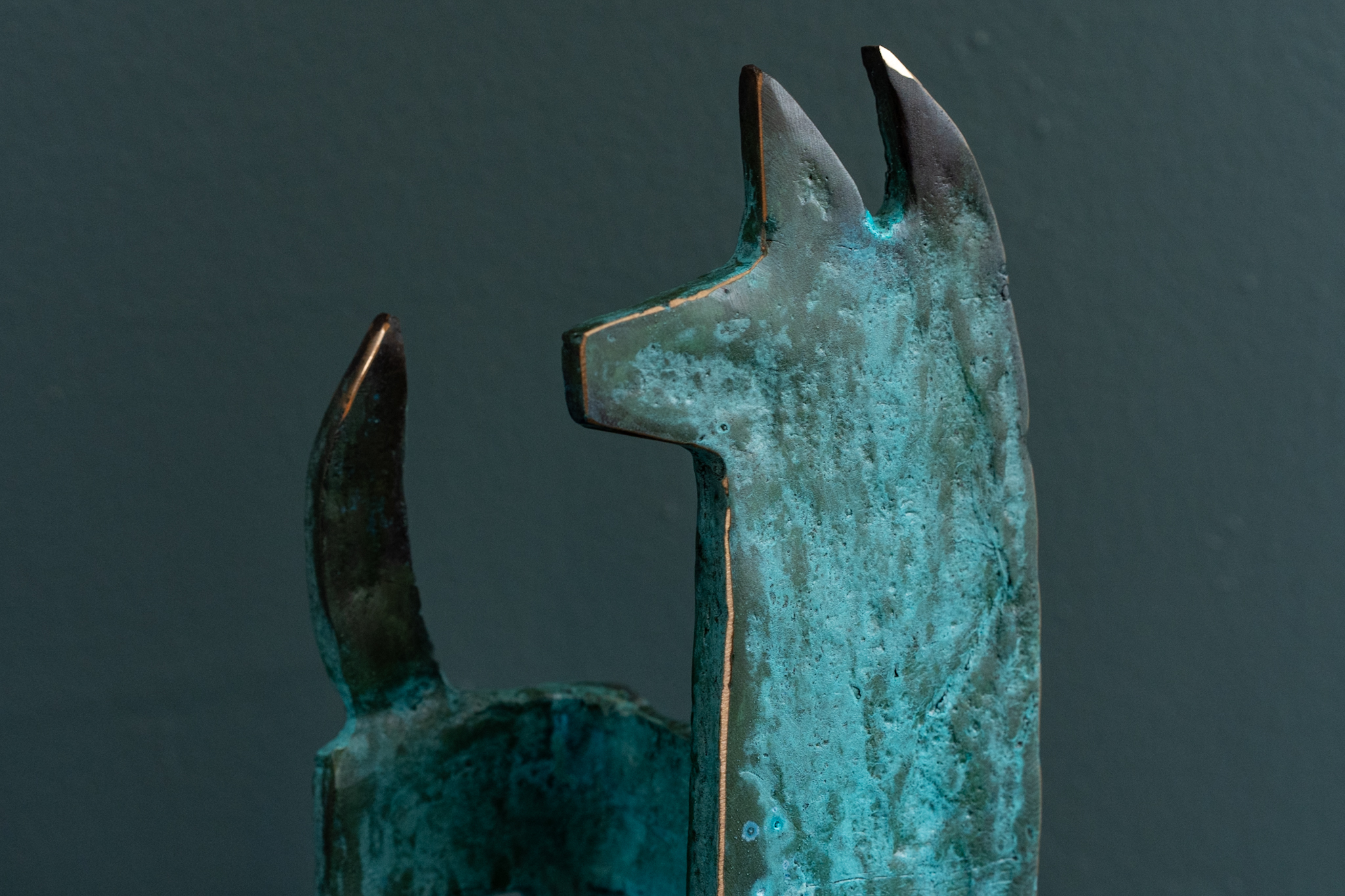 Bronze Dog looking left bronze edges light to dark green patination original Irish art bronze sculpture animals animal sculpture beautiful piece Kilbaha Gallery